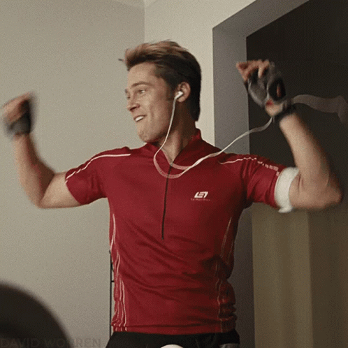 Brad Pitt enthusiastically dancing in a gym