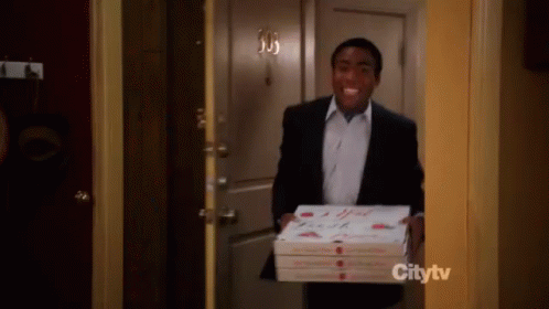 Donald Glover (aka Childish Gambino) delivering pizzas in a chaotic scene from 'Community'