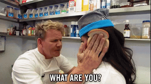 Gordon Ramsay places two bread slices on a girl's head and exclaims 