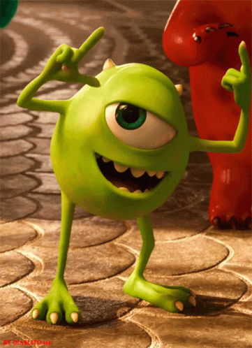 Mike Wazowski excitedly and emphatically pointing with two fingers.