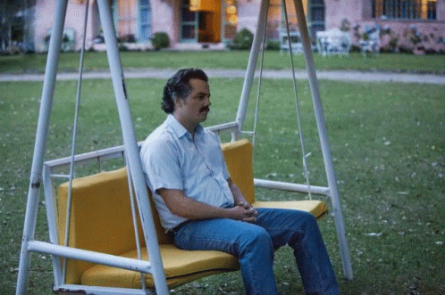 A gif featuring a forlorn Pablo Escobar, his face expressing sadness and despair. The caption reads: 'Sometimes the loneliest place is at the top.'