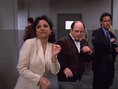 The iconic Seinfeld trio dancing hilariously out of sync.