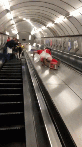 Someone stumbling and falling on an escalator