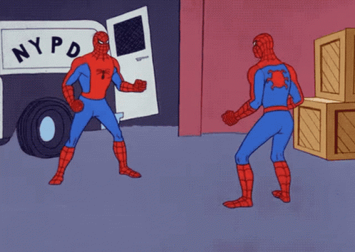 Two Spider-Men pointing at each other in realization and similarity.