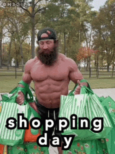 A muscular man showcasing his strength and masculinity by effortlessly carrying multiple shopping bags.